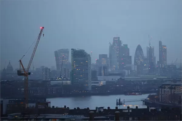 The City of London financial district is seen during early morning mist from Greenwich