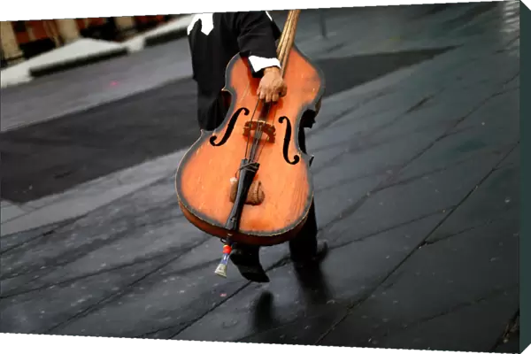 A musician holds a double bass at Garibaldi square in Mexico City