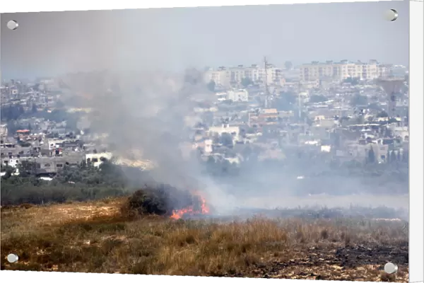A fire burns in scrubland in Israel near the Gaza Strip