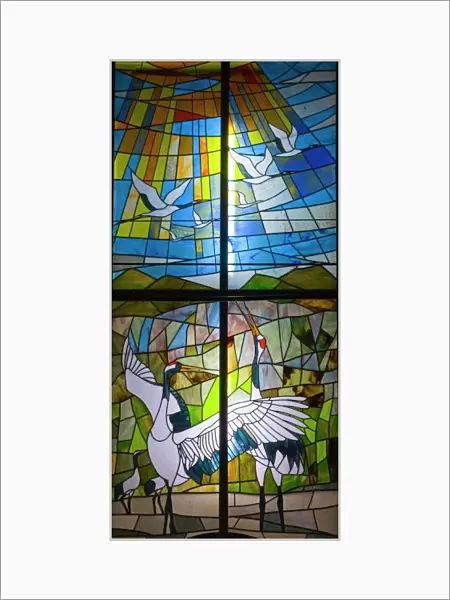 Stained glass window in church near Akan Hokkaido depicting Japanese Cranes
