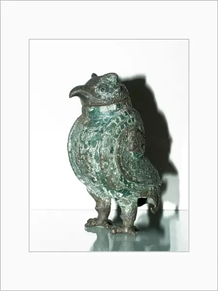 Wine vessel in the shape of an owl dating back to the Shang Dynasty in China 1250-1055 BC