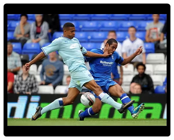 Birmingham City vs Coventry City: Intense Battle for the Ball - Cyrus Christie vs Jean Beausejour