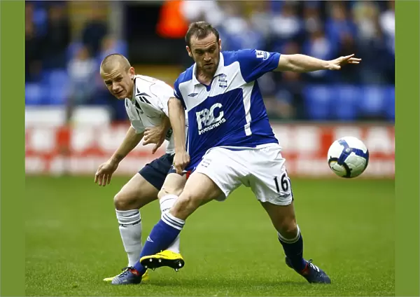 Battling for Supremacy: McFadden vs. Weiss in the Barclays Premier League Clash between Birmingham City and Bolton Wanderers (09-05-2010, Reebok Stadium)