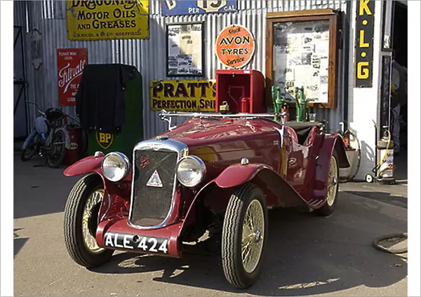 Goodwood Revival Classic car outside old garage red 2000s