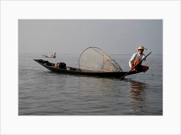 Traditional fishermen with fish traps in boats, Inle Lake, Shan State, Myanmar, January