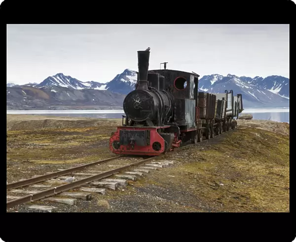 Historic coal mining stream train in tundra, Ny-Alesund, Spitsbergen, Svalbard, August