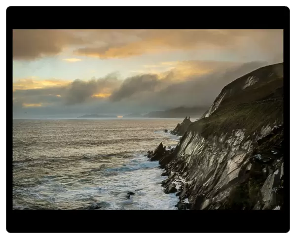 View of sea cliffs at sunset, Coumeenole North, Dingle Peninsula, County Kerry, Munster, Ireland, November