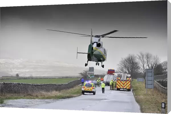 Air Ambulance attending road traffic accident in icy weather, Kirkby Stephen, Cumbria, England, December