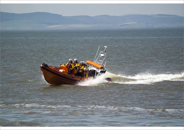 RNLI B-class Atlantic 85 rigid inflatable lifeboat, on training manoeuvres at sea, Silloth, Solway Bay, Cumbria