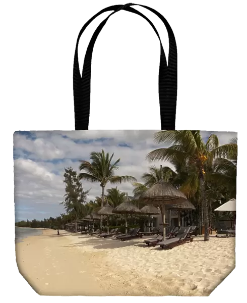 Sandy beach with sunloungers, sunshades and hotel building, Le Telfair Hotel, Bel Ombre, Southwest Mauritius