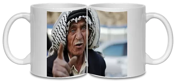 Market vendor, man talking, close-up of head, Amman, Jordan, november
