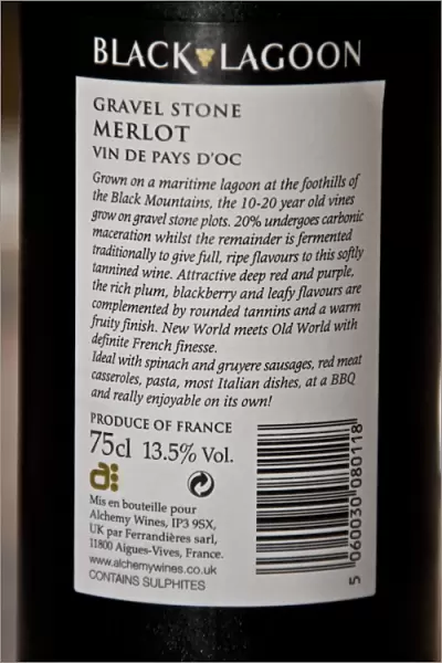 Close-up of Merlot wine bottle label, showing alcohol content and recycling symbol