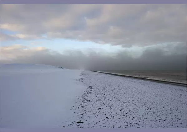 View of snow covered beach, Salthouse, Norfolk, England, december