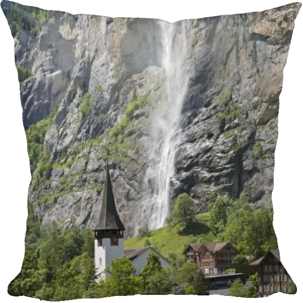 Waterfall flowing over mountain cliff, Staubbach Falls, Lauterbrunnen, Bernese Alps, Switzerland, June