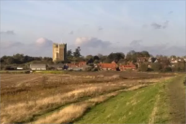 Looking along the sea wall toward Orford showing Orford castle and church, boats on the River Alde