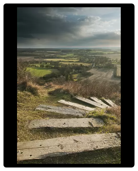 Steps leading from The Devils Kneading Trough at sunset, looking towards Ashford, Wye Downs, North Downs, Kent