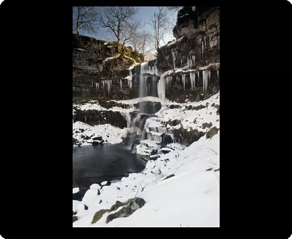 View of partially frozen waterfall with icicles, Uldale Force, River Rawthey, Baugh Fell, Howgill Fells, Cumbria