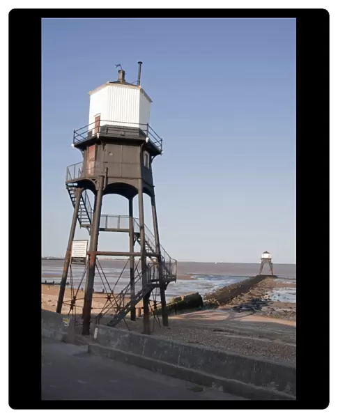 Victorian cast iron lighthouses on beach, Dovercourt, Harwich, Essex, England, July