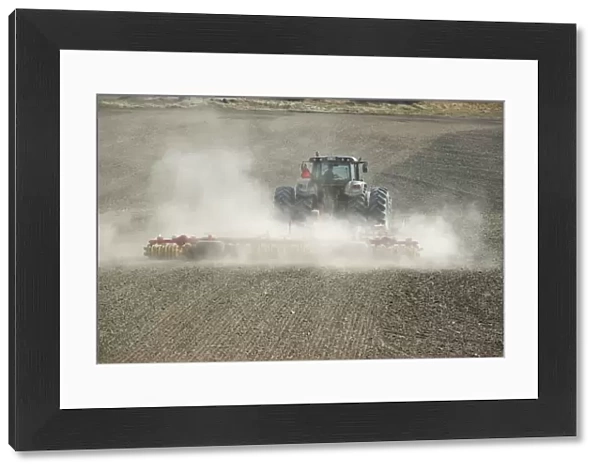 Valtra tractor with Vaderstad NZA-800 and Vaderstad RS-820 harrows and rollers, cultivating dusty arable field, Sweden