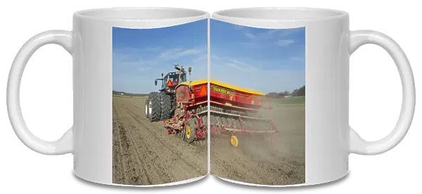 Valtra tractor with Vaderstad Rapid 400C seed drill, drilling arable field, Sweden, may