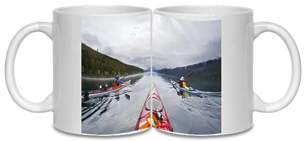 Canada, British Columbia, Bowron Lakes Provincial Park. Sea kayakers on 24-mile long Isaac Lake