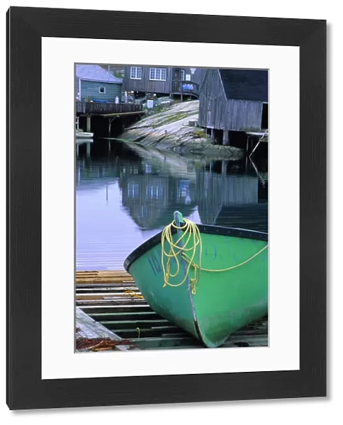 N. A. Canada, Nova Scotia, Peggys Cove. Green dinghy in harbor