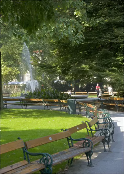 Empty benches in the Rathauspark (Vienna City Hall Park), Vienna, Austria