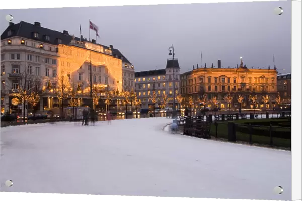 Denmark, Copenhagen, Kongens Nytorv at Christmas. Hotel d Angleterre and skating ring