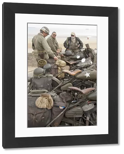 France, Normandy, Arromanches. Vintage military motorcycles on famous battlefield