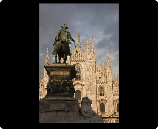 ITALY, Milan Province, Milan. Milan Cathedral and statue, late afternoon