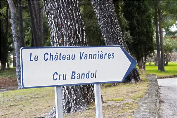 Sign with text Le Chateau Vannieres, Cru Bandol and pine forest Chateau Vannieres
