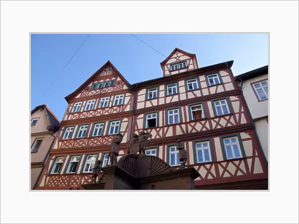 Germany, Franconia, Wertheim. Famous Angels Well in front of historic homes