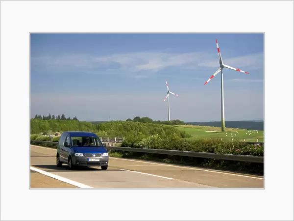 Electricity wind generators and automobiles traveling on the autobahn in northwest