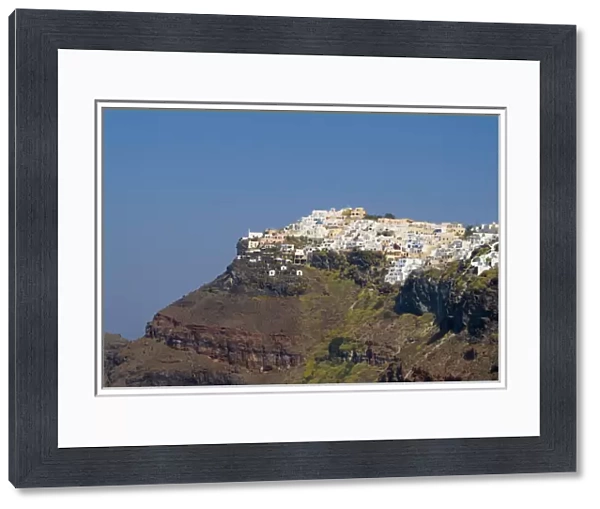 Santorini Greece and the beautiful white buildings on the mountain cliffs of main