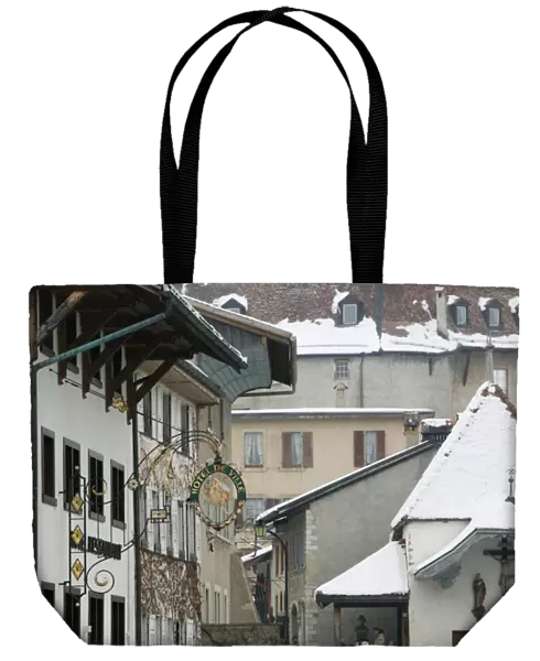SWITZERLAND-Fribourg-GRUYERES: Buildings along Main Street  /  Winter