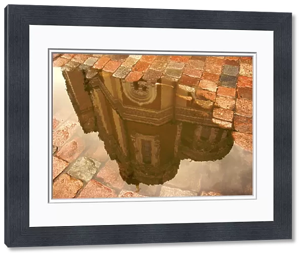 Europe, Estonia, Tallinn. Reflection of Alexander Nevsky Cathedral in puddle of rain water