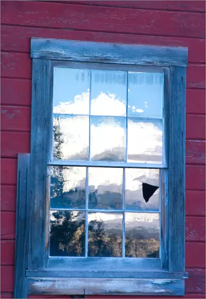 N. A. USA, Alaska. A reflection of the Wrangell Mountains in the window of the historic