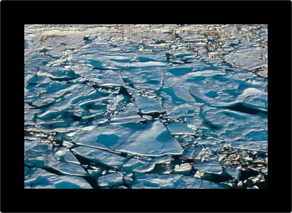 aerial of multi-layer ice (freshwater pans formed over the years where the salt is