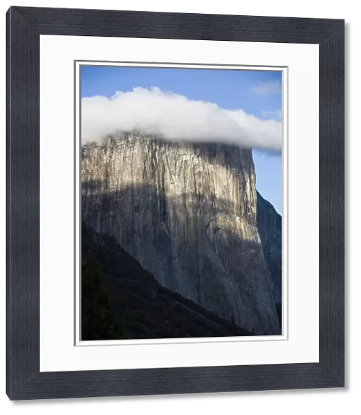 A cloud forms atop El Capitan shrouding the top of the cliff-face - Yosemite National Park