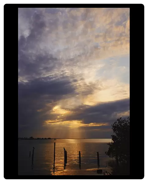 Remnants of old pier at sunset, Sanibel Island, Florida