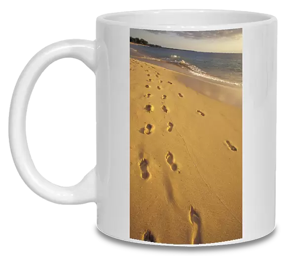 USA, Hawaii, Maui, Makena Beach Footprints in the sand, evening light