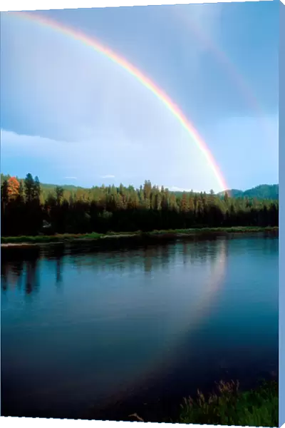 Rainbow over the north fork of the PayetteRiver in Idaho. rain, rainbow, weather