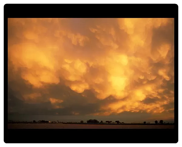 USA, Idaho. Underside of thunder storm at sunset
