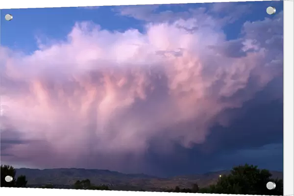 Summer storm cloud at sunset over the foothills near Boise, Idaho, USA