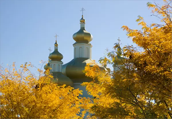 BALTIMORE, MARYLAND. USA. Domes of St. Michael Ukranian Orthodox Church rise above trees in autumn