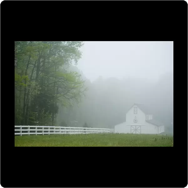 White farmhouse and fence in mist, Powhatan, Virginia, United States