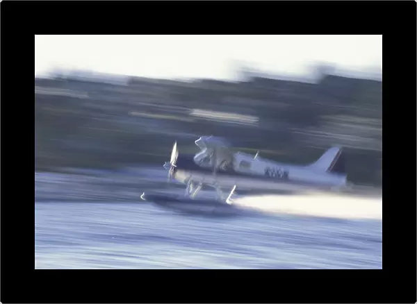 NA, USA, Washington, Seattle Float plane taking off from Lake Union