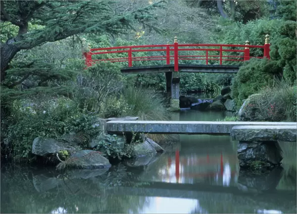 Red Japanese bridge and pond at Kubota Gardens, Renton, Washington
