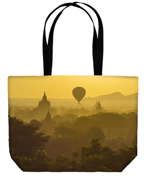 Myanmar. Bagan. Hot air balloons rising over the temples of Bagan