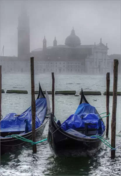 Gondolas along the Grand cana with San Giorgio maggiorel of Venice, Italy